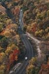 railway tracks run through autumn landscape