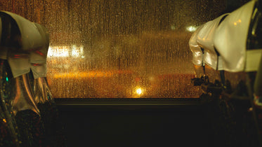 rain drops cascading down bus window