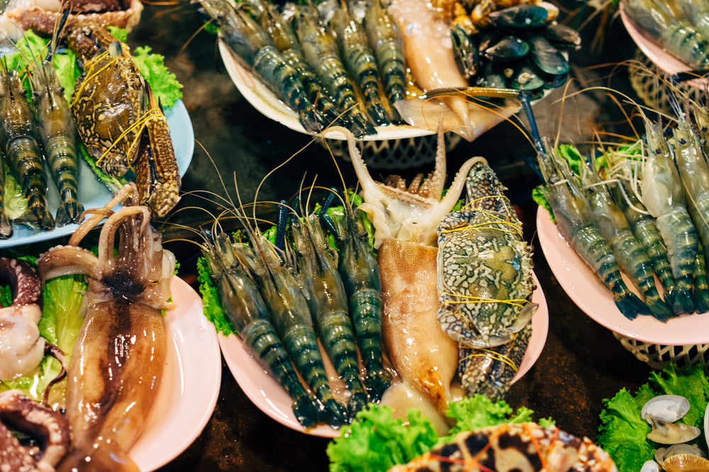 raw seafood in bowls viewed from above