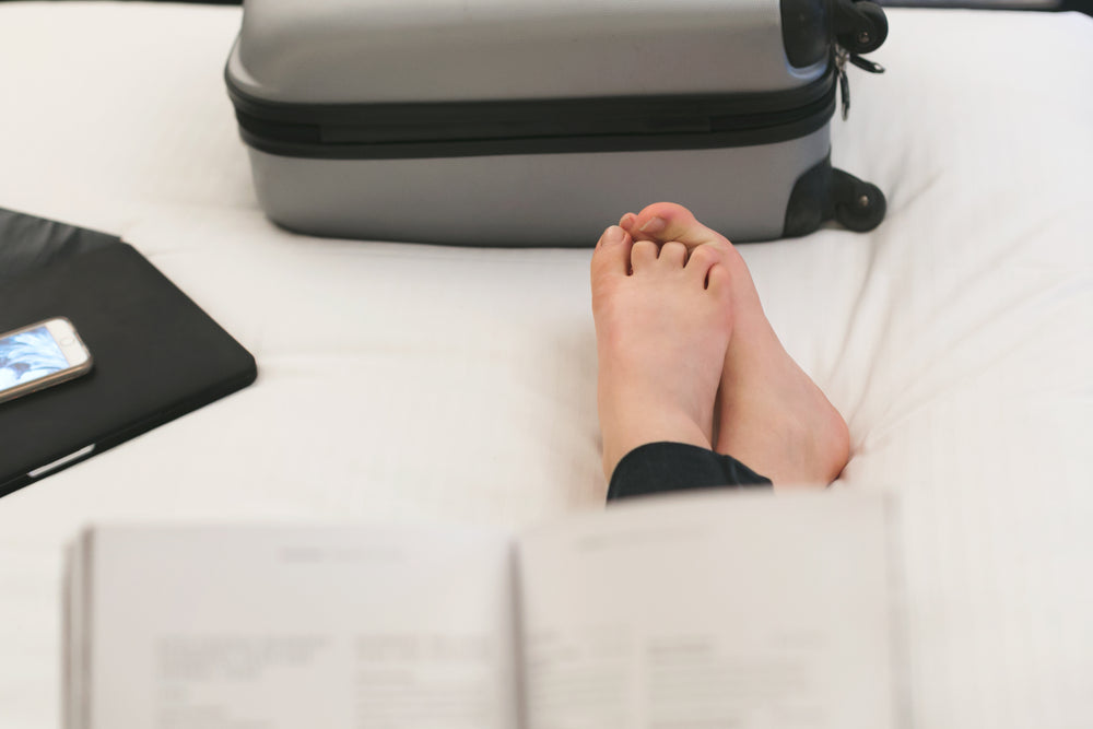 reading on hotel bed