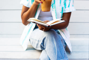 reading with an iced coffee in summer