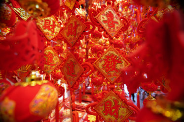 red and gold squares hang from the ceiling