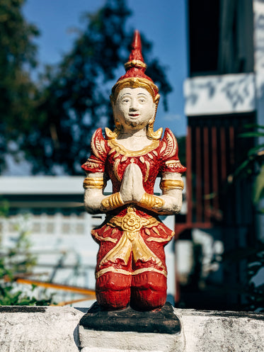 red and gold statue outdoors