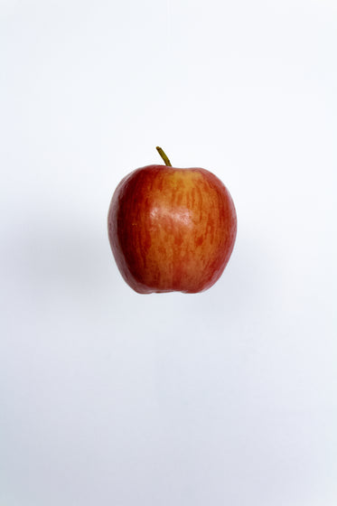 red apple against white background