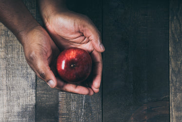 red apple in hand