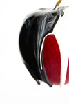 red apple with black and white paint
