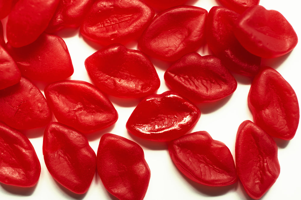 red candy lips on a white background