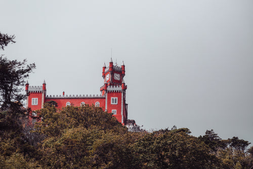 red castle and clock tower
