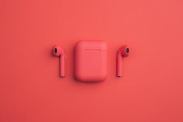 red earbuds and smartphone