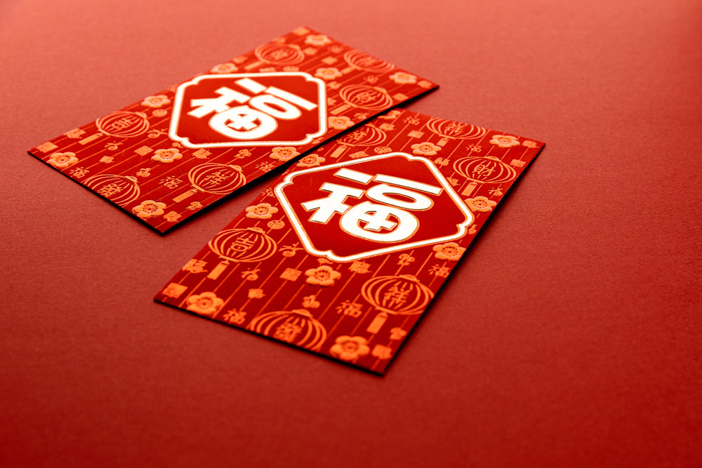 red envelopes decorated with lanterns and chinese symbols