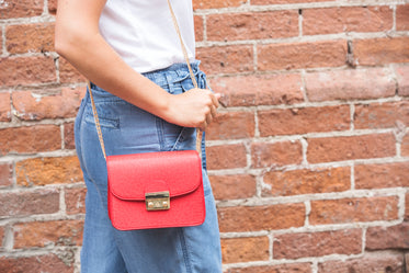red handbag with gold detail