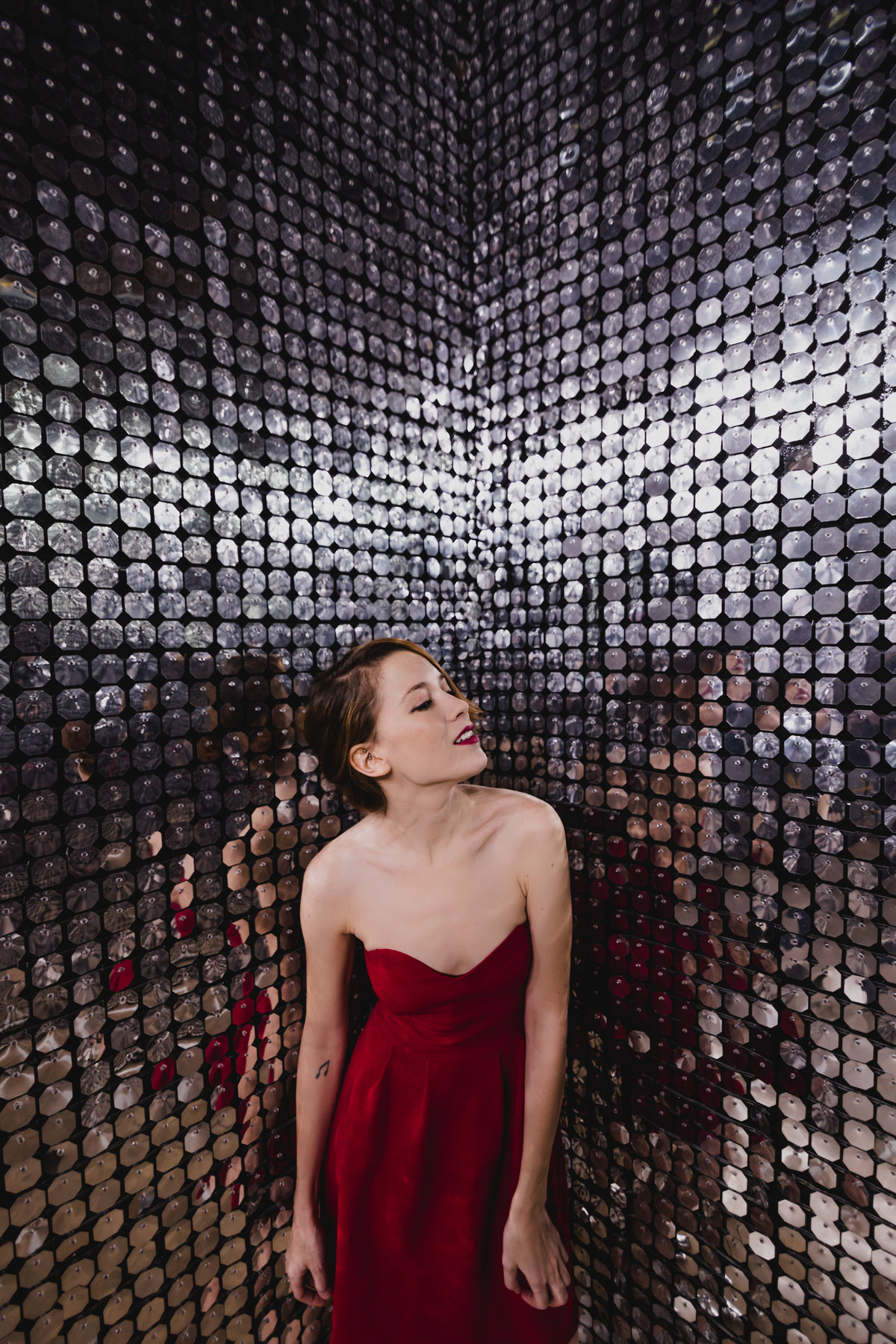 red party dress in silver room