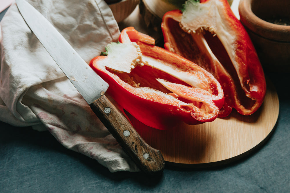 red pepper and a silver knife photo