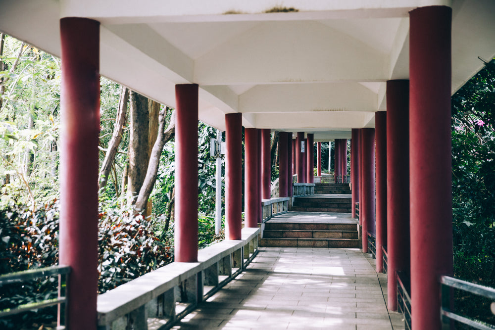 red pillars line a walkway