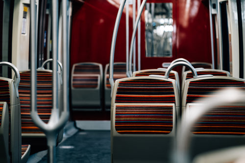 red seats of a public transit vehicle