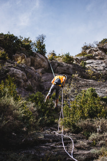 repelling a rock face