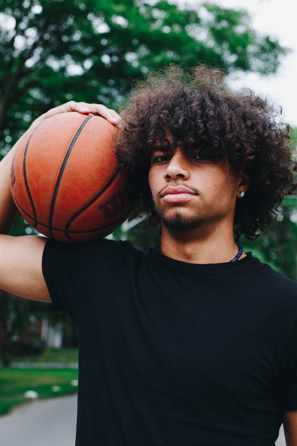 resting basketball on the shoulder