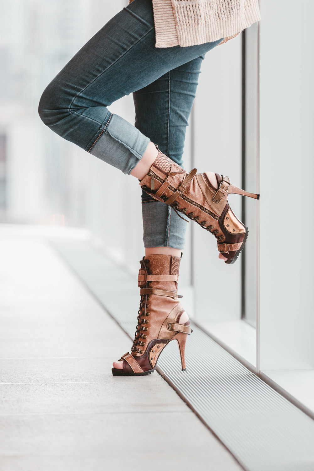 resting by a window in heels