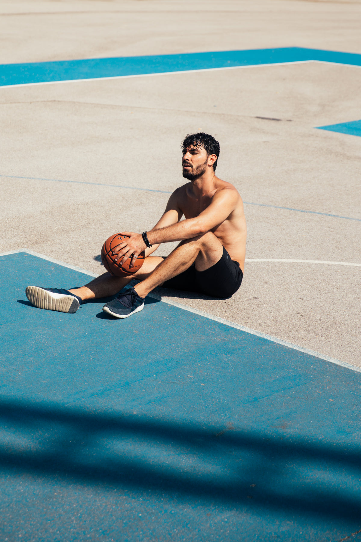 resting on basketball court