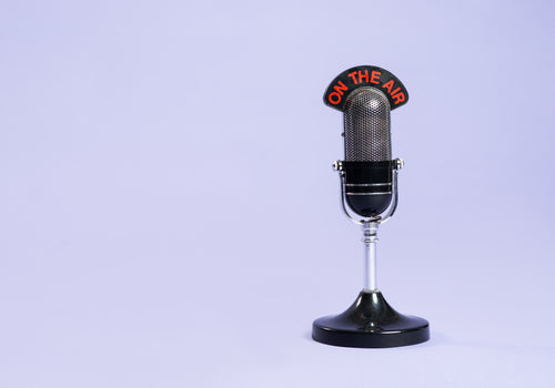 retro radio microphone against purple background