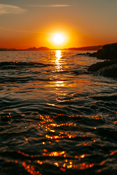 rich sunset reflected on waters