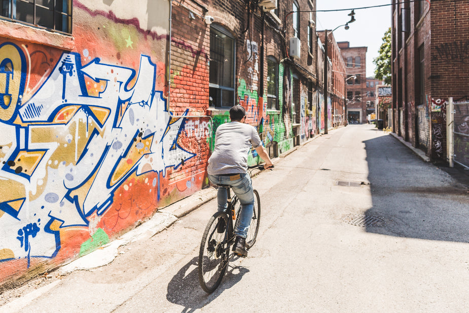 Free Riding Bike Through City Photo — High Res Pictures