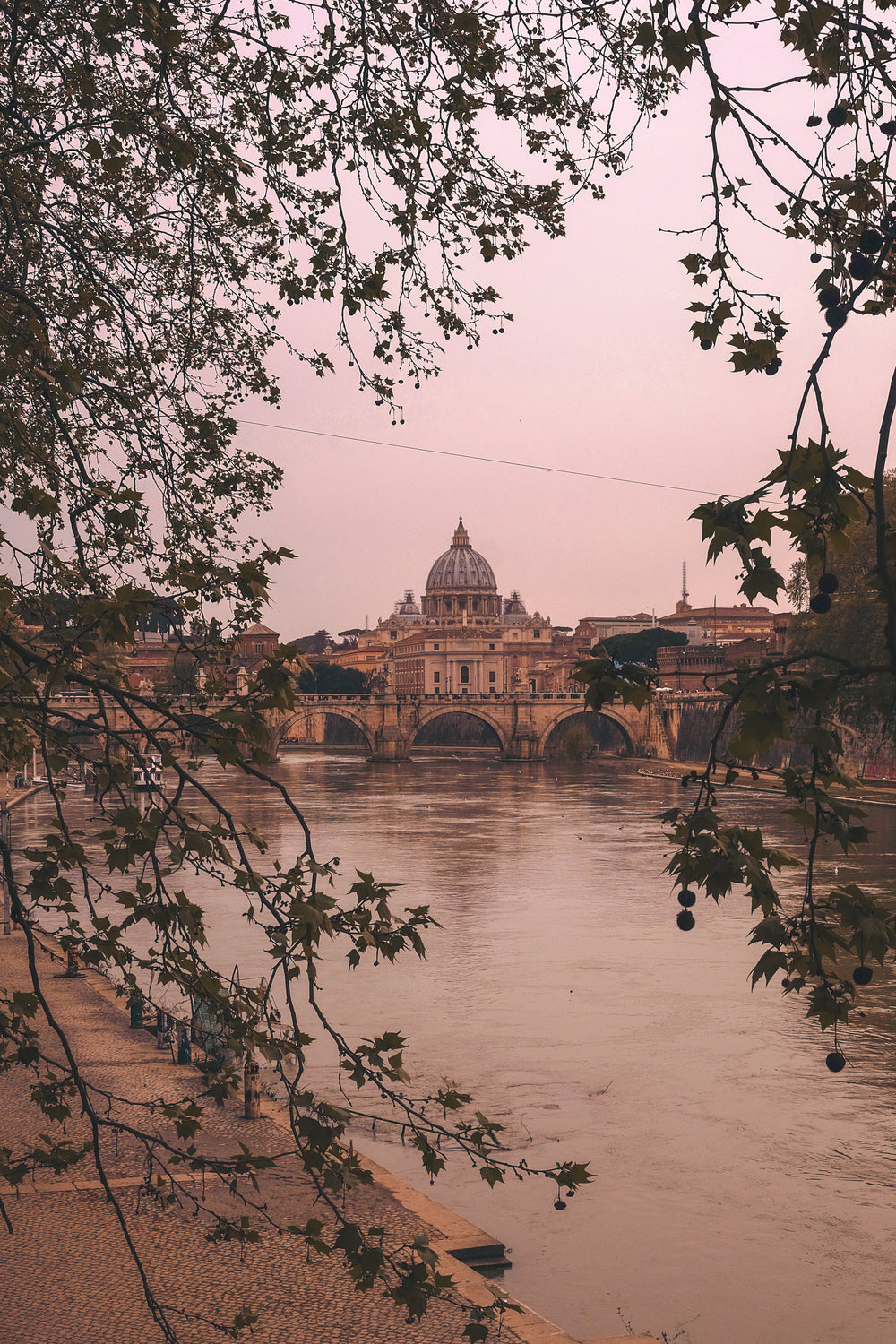 riverbank with basilica and bridge