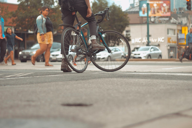 Road Bike And Rider In City