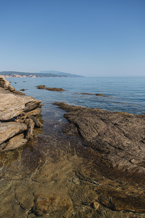 rocky coast with open ocean and blue sky