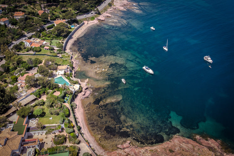 rocky-coastline-town-with-clear-sea.jpg?