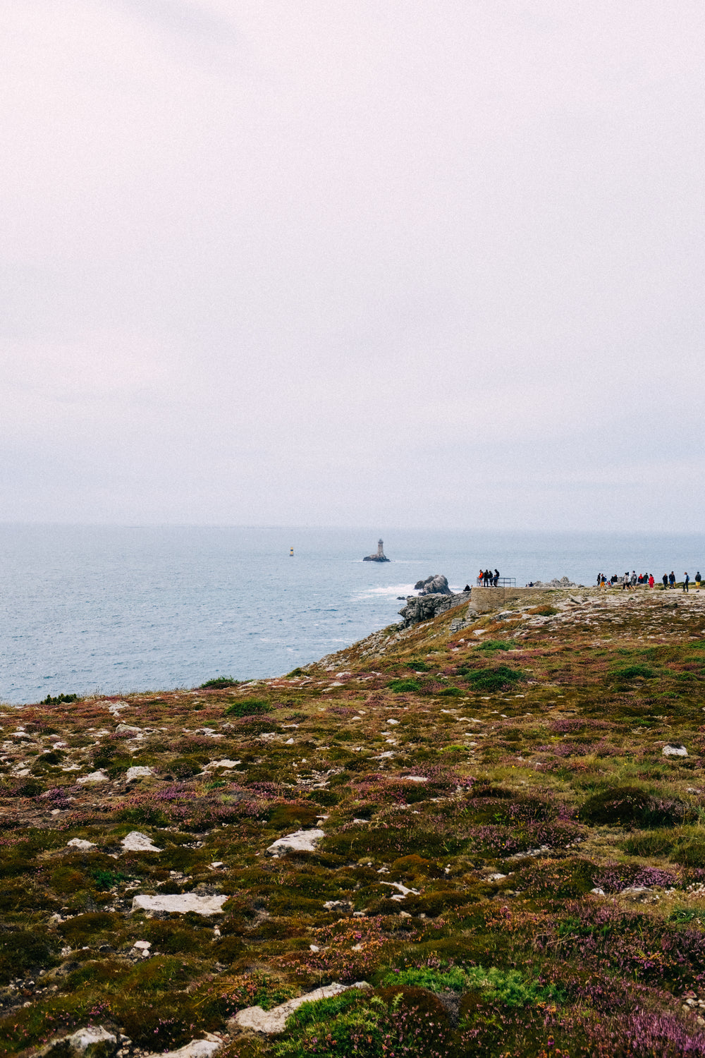 rocky coastline with people enjoying the view