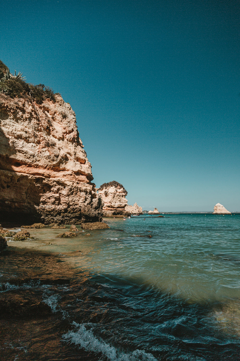 rocky lagos cliffs protrude out into the ocean