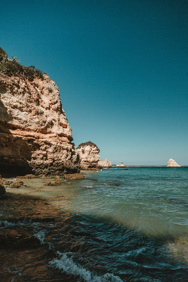 rocky lagos cliffs protrude out into the ocean