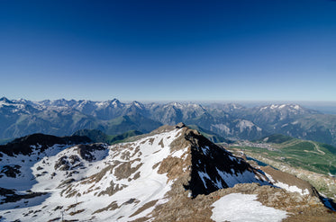 rocky mountain tops against a blue sky