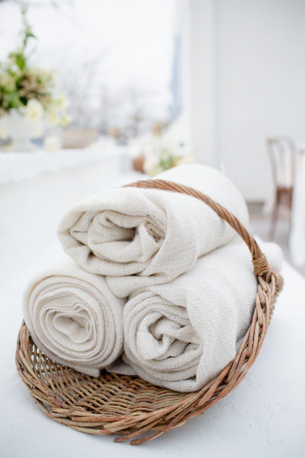 rolled fabric in a wicker basket