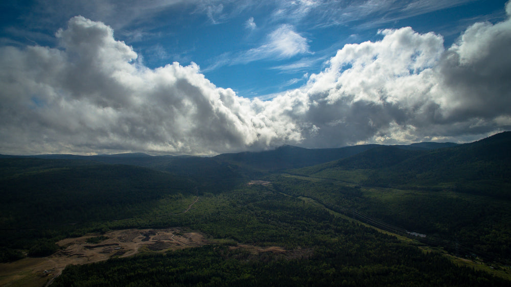 rolling couds over peaks and valleys