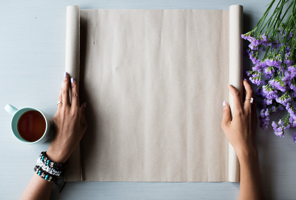 rolling out paper with purple flowers