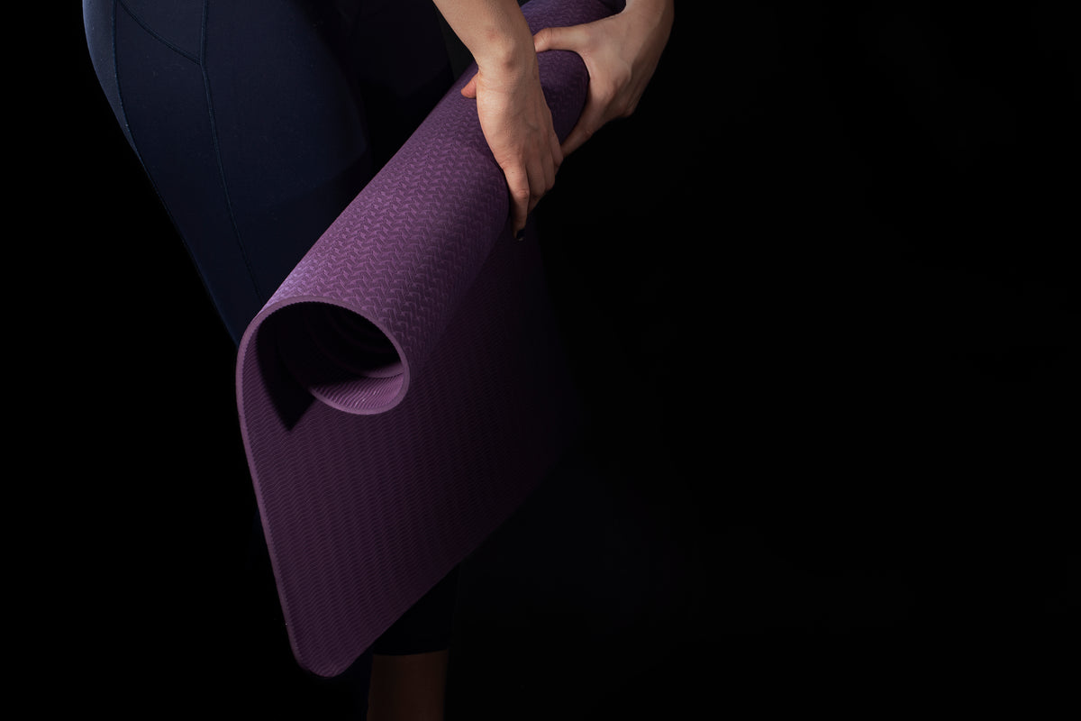 rolling purple yoga mat