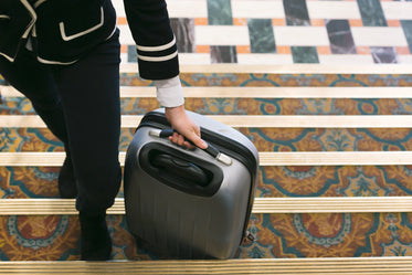 rolling suitcase into hotel