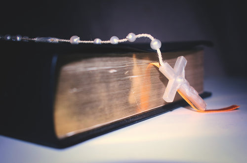 rosary resting on bible