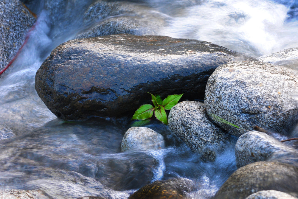 round stones in rushing water