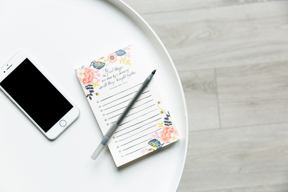 Browse Free HD Images of Round White Table With Phone And Notepad