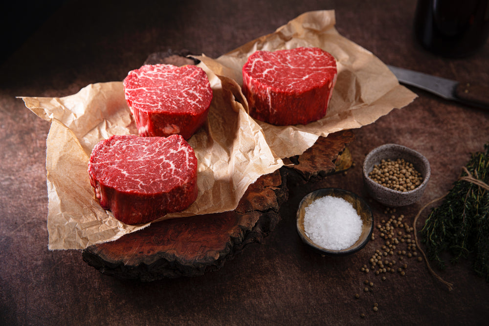 rounds of raw meat on butcher paper