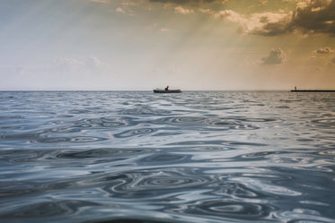 row boat on calm water