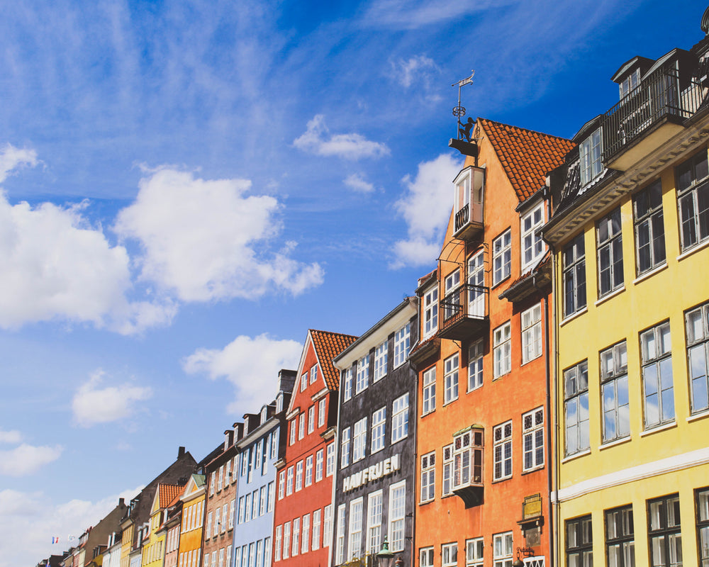 row of colorful buildings on a sunny day