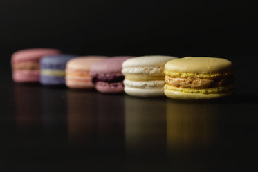 row of macarons with reflection