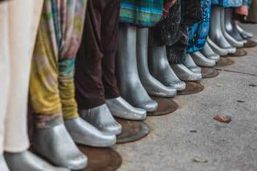 row of mannequin feet from storefront