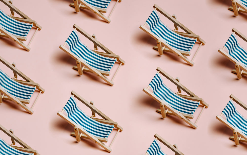 Rows Of Beach Chairs With Blue And White Fabric