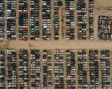 rows of cars in junk yard aerial