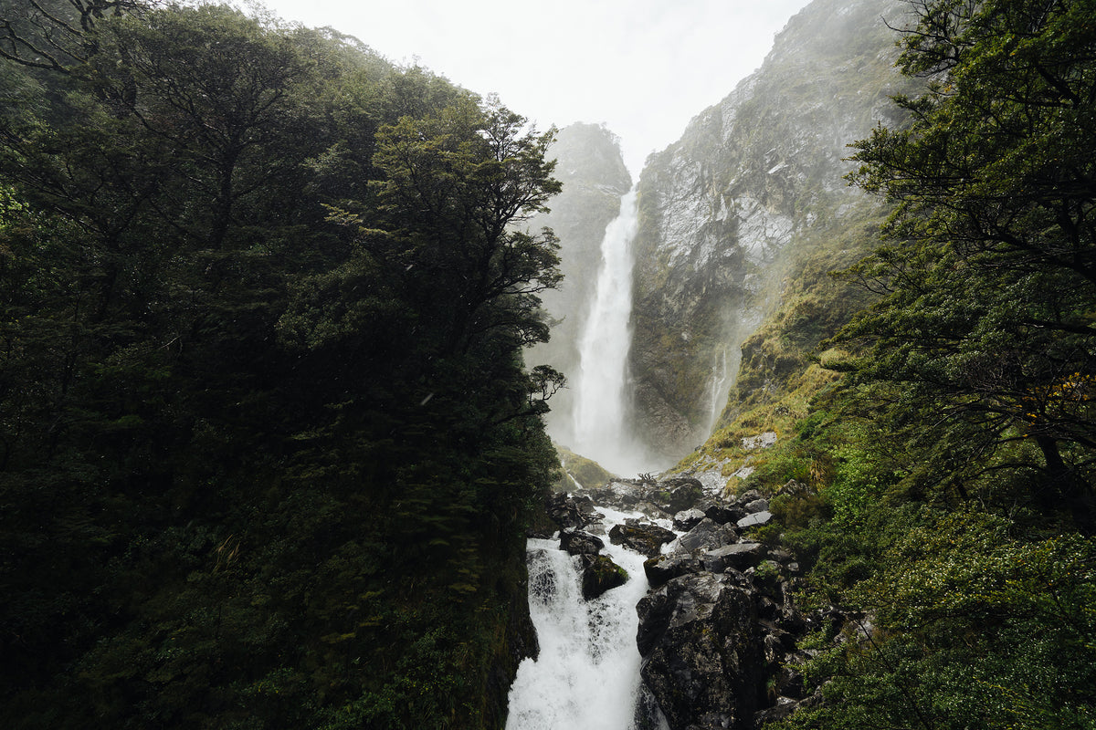 rushing waterfall down mountain